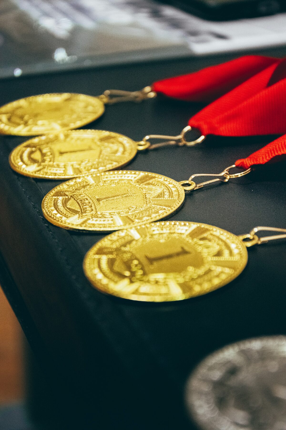 Gold medals with red ribbons